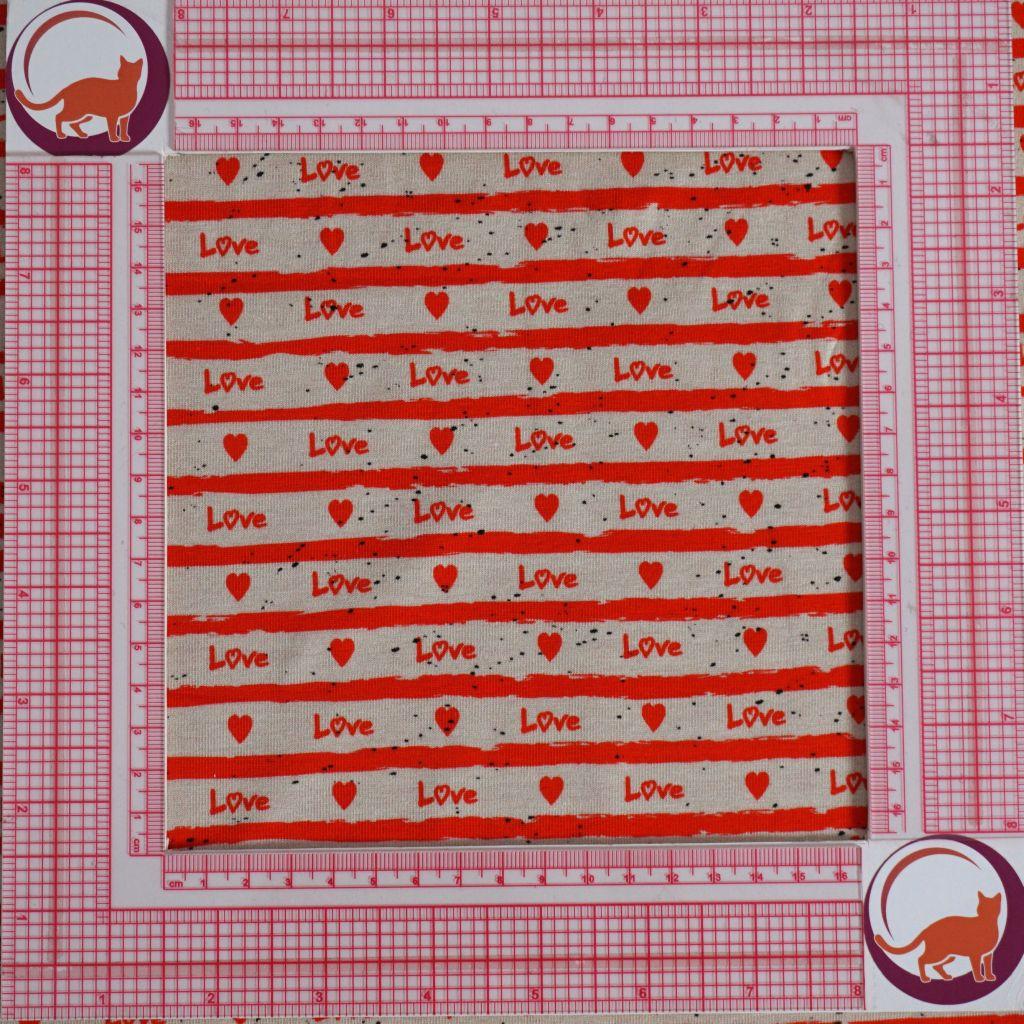 Baumwolljersey Text "Love" Herzen rot ecru
